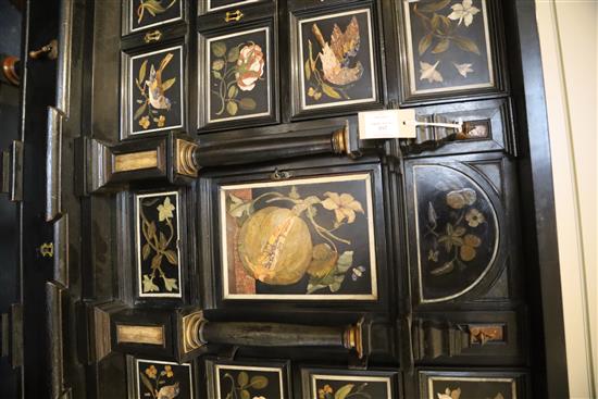 A 17th/18th century Italian and later pietra dura and ebony veneered cabinet on an ebonised wood stand, W.4ft 2in. D.1ft 7in. H.4ft 6.5